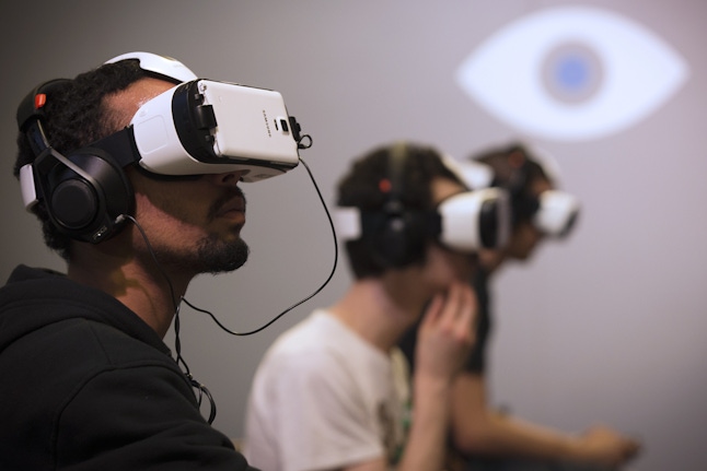 Players use Oculus virtual reality headseats at the Paris Games Week show on November 1, 2014 in Paris. AFP PHOTO / JOEL SAGET (Photo credit should read JOEL SAGET/AFP/Getty Images)